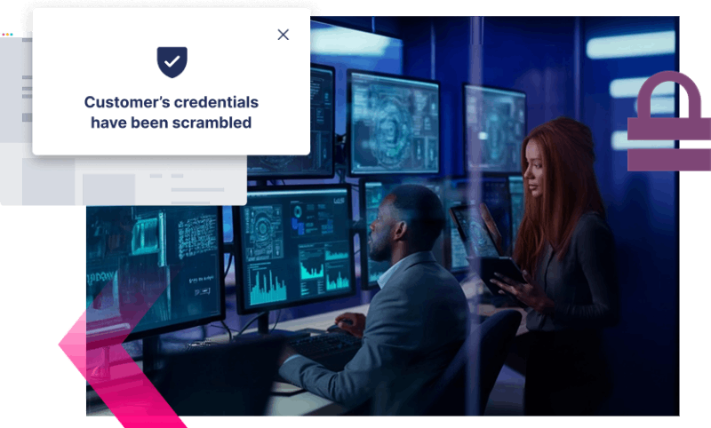 Two people work at computer monitors displaying cybersecurity data; a message on screen reads, "Customer’s credentials have been scrambled," highlighting the importance of Digital Impersonation protection.